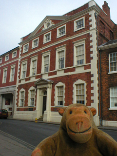Mr Monkey looking at the outside of Fairfax House