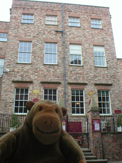 Mr Monkey looking at the back of Fairfax House