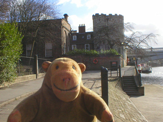 Mr Monkey looking at the Lendal Tower from the riverside