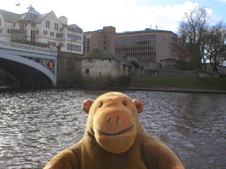 Mr Monkey looking looking at the North Street Postern Tower from the riverside