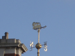 A weathervane in the shape of a steam locomotive