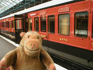 Mr Monkey looking at an LSWR Tri-composite Brake Carriage