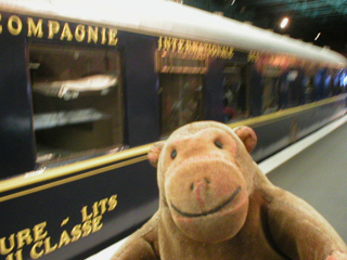 Mr Monkey looking at a wagon lits carriage
