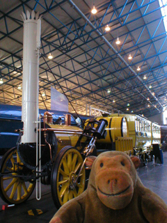 Mr Monkey looking at a replica of Stephenson's Rocket