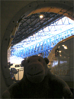 Mr Monkey looking at a Eurostar locomotive and tunnel section