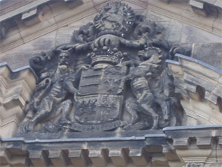 The coat of arms over the front door