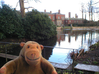 Mr Monkey looking at the narrow bridge across the canal