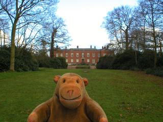 Mr Monkey looking at the house from  the drive to the north