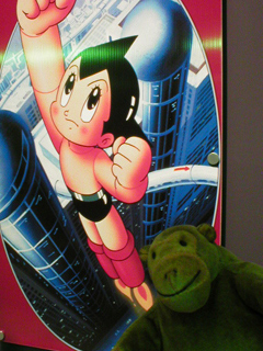 Mr Monkey looking at a picture of Astroboy