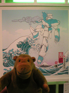 Mr Monkey looking at the Daylight Raid panel of the Great Wave Diptych