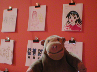 Mr Monkey looking at drawings by visitors to the exhibition