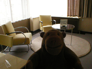 Mr Monkey looking at the sitting area of the master bedroom