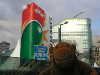 Mr Monkey looking at a giant inflatible Cornflake packet