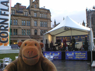 Mr Monkey watching a band outside Urbis