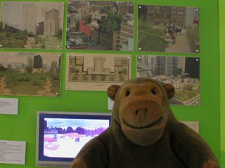 Mr Monkey examining a display about green roofs