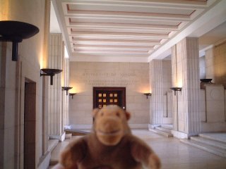 Mr Monkey in a University hallway