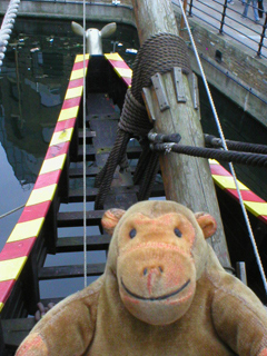 Mr Monkey looking down at the beakhead of the Golden Hinde