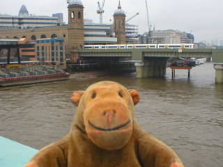 Mr Monkey looking at the rail bridge into Cannon Street station