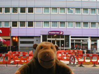 Mr Monkey looking at the Premier Inn Euston 