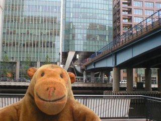 Mr Monkey looking at the DLR track at Canary Wharf
