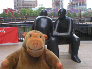 Mr Monkey looking at Giles Penny's Two Men on a Bench