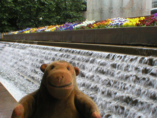 Mr Monkey looking at the cascade around Cabot Square