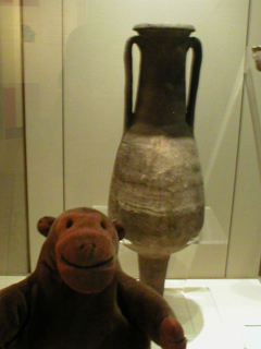 Mr Monkey looking at a Roman amphora