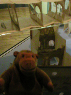 Mr Monkey looking at peepshows advertising Brunel's tunnel