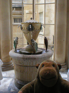 Mr Monkey examining the water fountain in the Pump Room