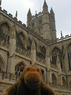 Mr Monkey looking at the side of Bath Abbey
