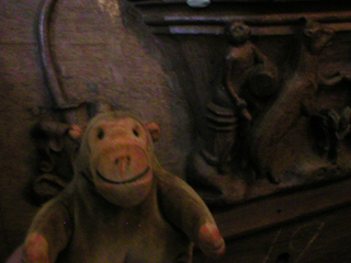 Mr Monkey inspecting misericords in the choir of Bristol cathedral