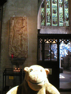 Mr Monkey looking at the Saxon stone and the entrance to the Newton chapel