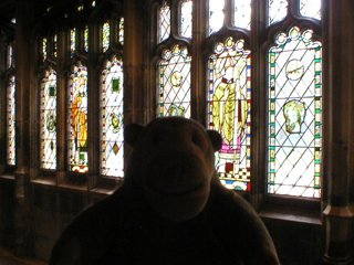 Mr Monkey looking stained glass in the cloister