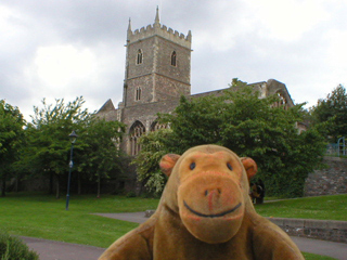 Mr Monkey looking at the shell of St Peter's church