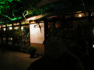 Mr Monkey outside the Spyglass restaurant at night