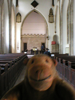 Mr Monkey looking along the nave of St John the Baptist's