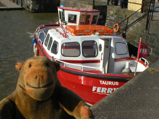 Mr Monkey looking down on the Taurus from the quay