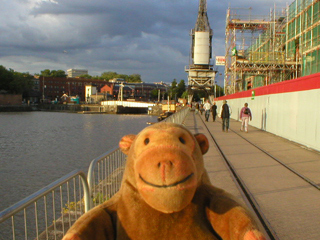 Mr Monkey walking past the Bristol museum building site
