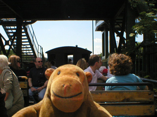 Mr Monkey on the quayside train ride looking towards the brake van
