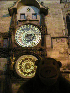 Mr Monkey looking at the Astronomical Clock by night