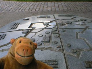 Mr Monkey looking at a relief map of Vyšehrad