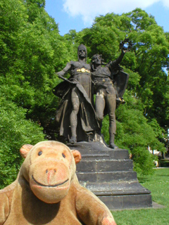 Mr Monkey looking at the statue of Záboj and Slavoj