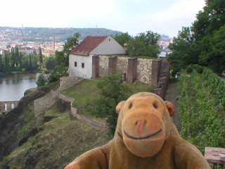 Mr Monkey looking at the Vyšehrad Art Gallery and the Baths of Libuše