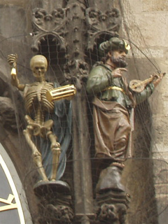 Death and the Turk to the right of the clock face