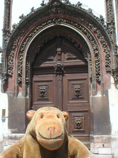 Mr Monkey looking at the door of the Old Town Hall
