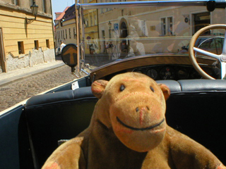 Mr Monkey driving down the narrow part of Loretánská
