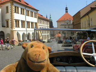 Mr Monkey driving down the wide part of Loretánská