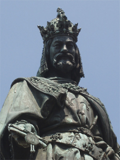 A cast iron Charles IV beside the Charles Bridge