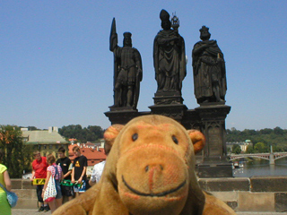 Mr Monkey looking at the statues of Saints Norbert, Wenceslas and Sigismund