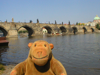 Mr Monkey looking at Charles Bridge from the Little Quarter side
